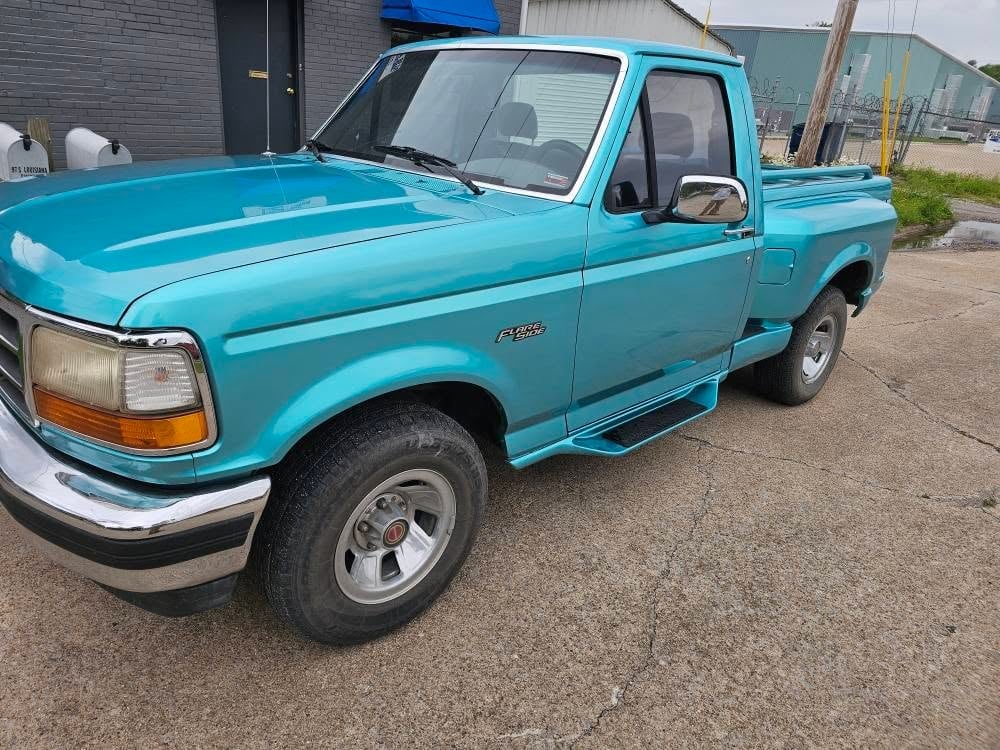 Restored Ford F-150 Flareside pickup with fresh paint